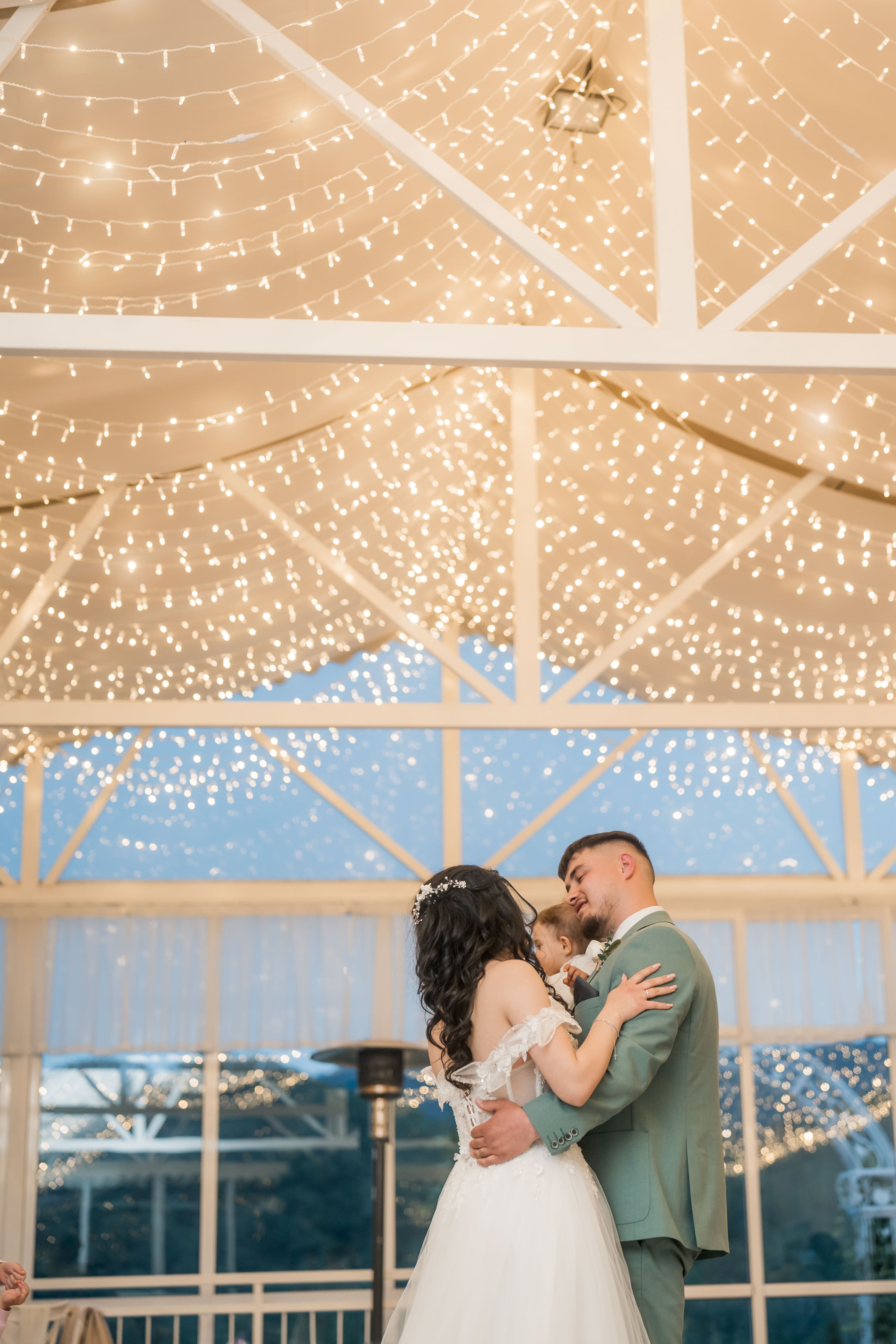 A couple beneath the marquee lights