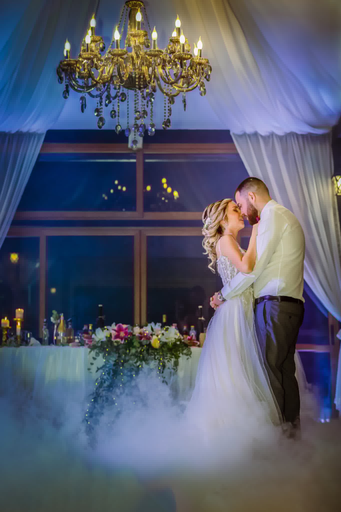 The bride and groom in a warm embrace