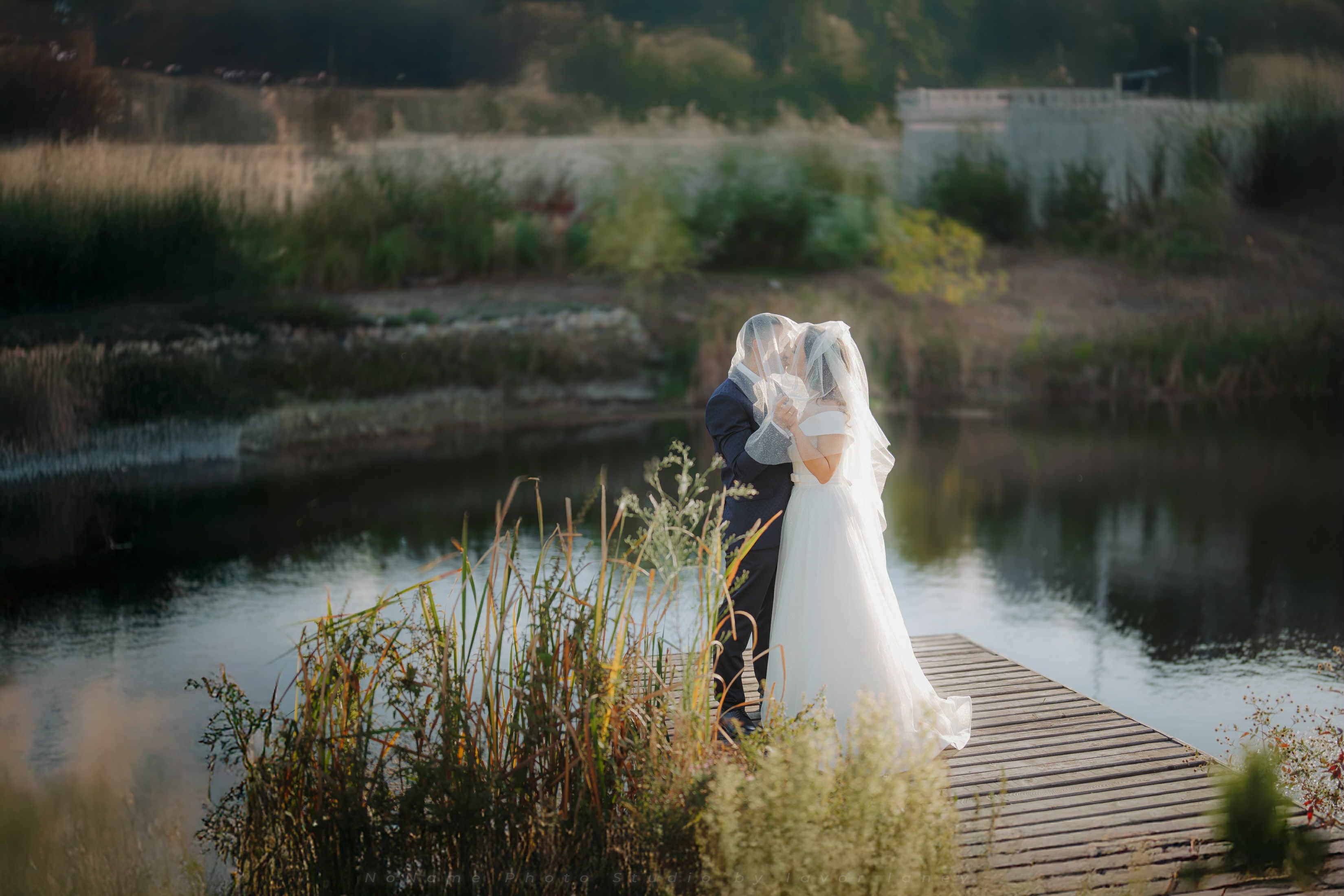 A bride by the reservoir at Ovech Resort Complex